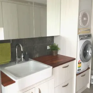 Washing Machine And Dryer Combo In Family Bathroom — Nyblad Construction in Caloundra West, QLD
