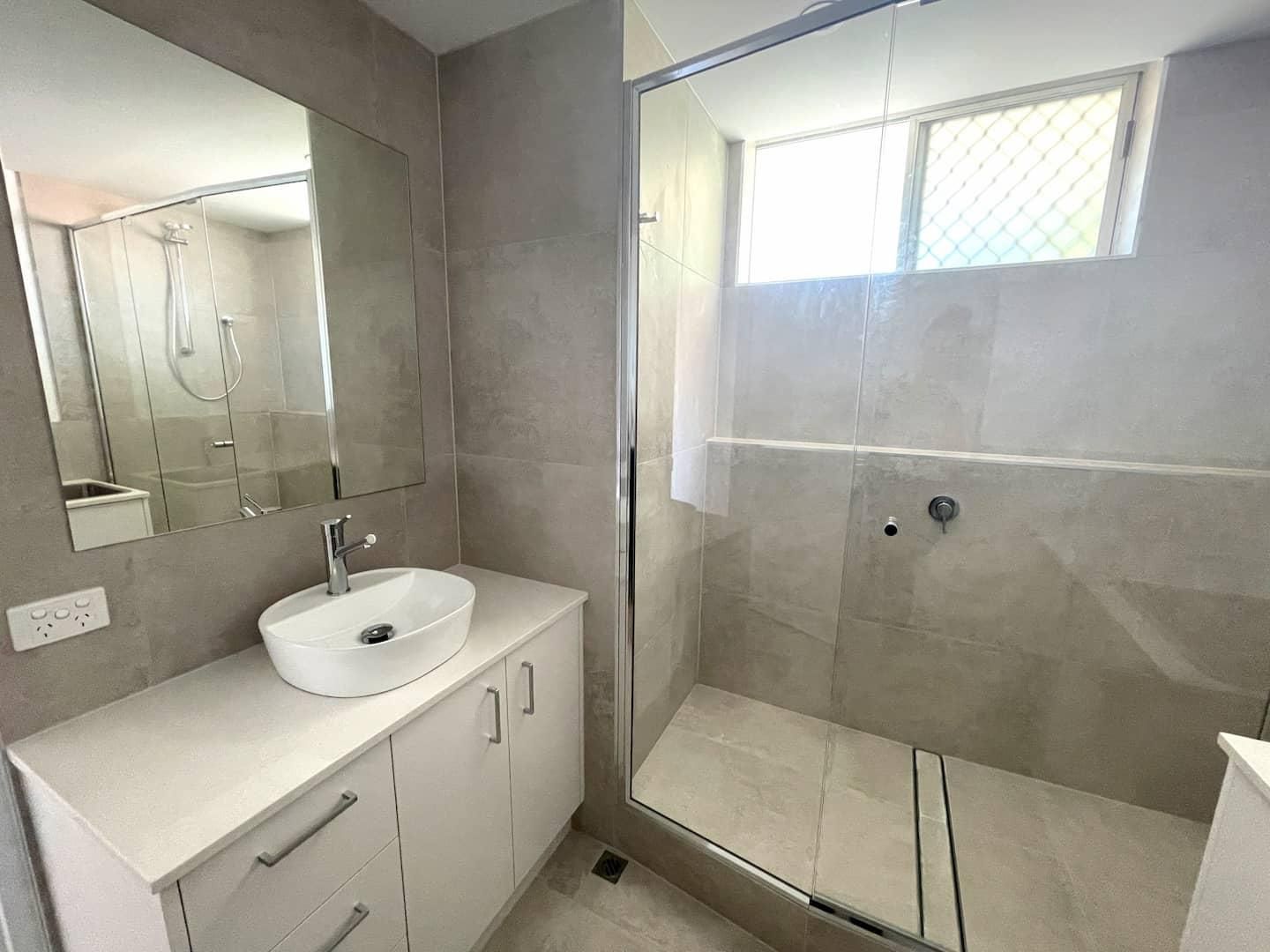 Bathroom With a Sink and a Walk in Shower — Nyblad Construction in Caloundra West, QLD
