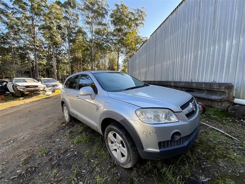 A Silver Car Is Parked On The Side Of The Road In Front Of A Building — Bago Auto Dismantlers in Wauchope, NSW