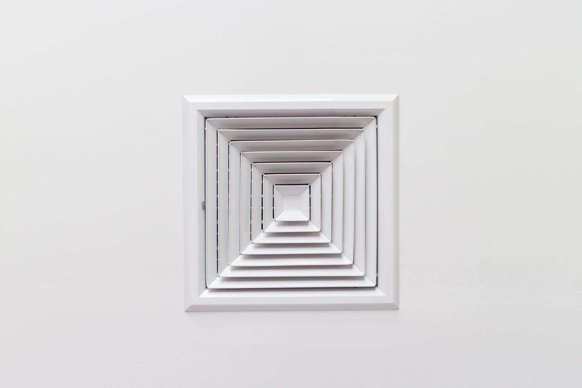 An overhead view of a room with a ceiling ventilation system installed.