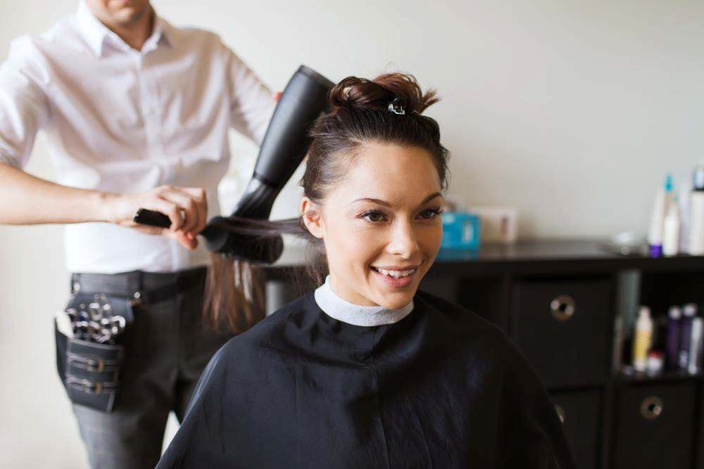 Woman Getting a Blowout at a Hair Salon — Elysian Salon In Wyong, NSW