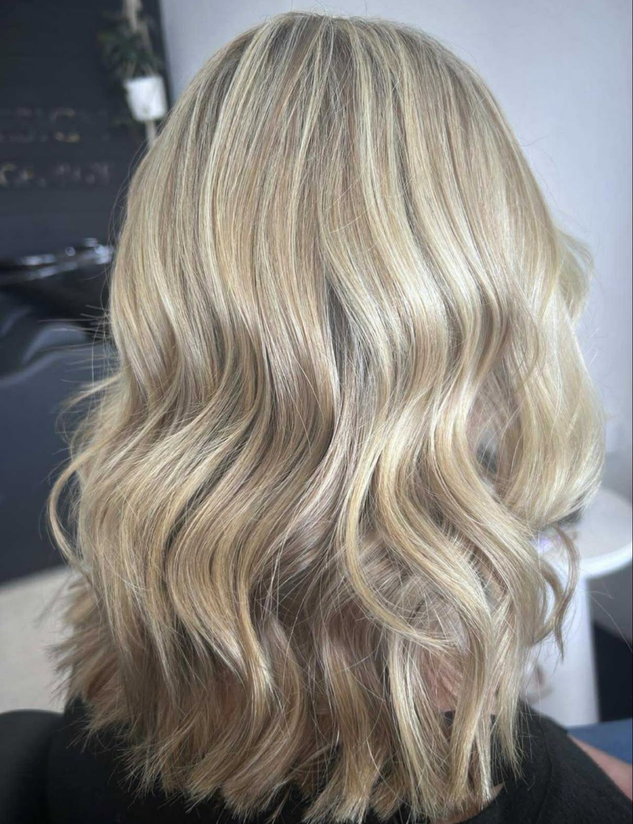 Curly Brown Hair With Pink Ombré Highlights Viewed From Behind in a Salon Chair — Elysian Salon In Wyong, NSW