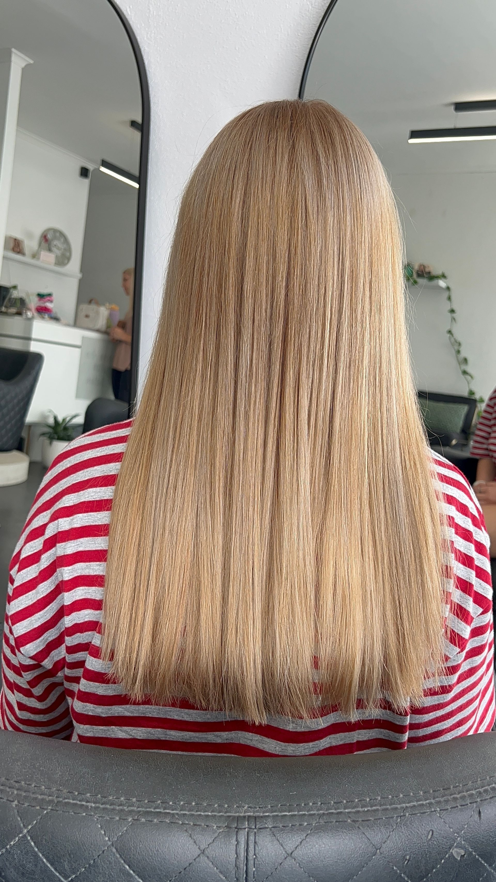 Back View of a Person With Long Blonde Curly Hair — Elysian Salon In Wyong, NSW