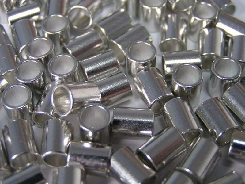 Stack of corrugated metal roofing sheets, gray color.