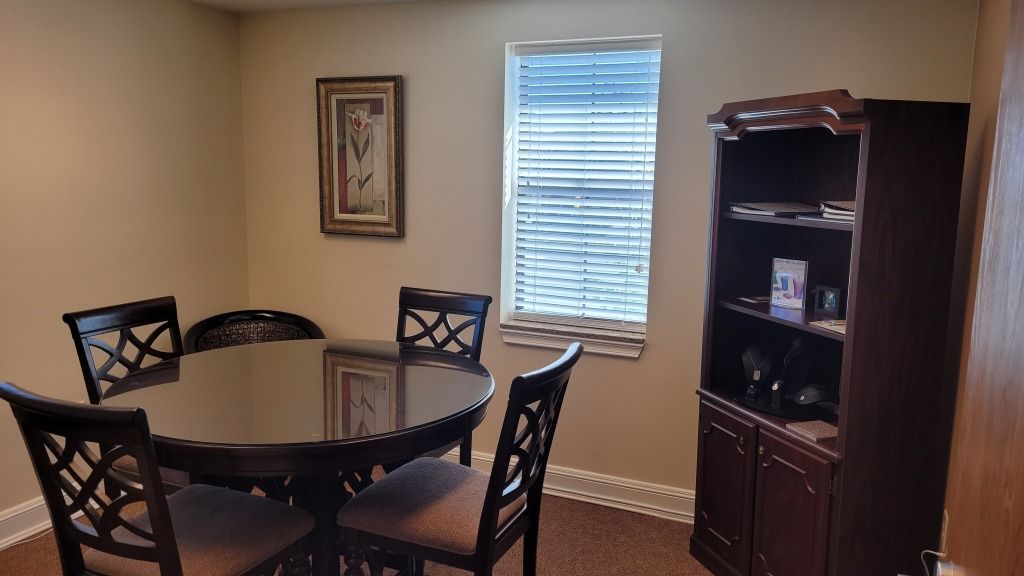 Highland Funeral Home Preplanning room with Chairs and Table