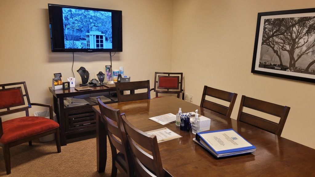 Highland Funeral Home Preplanning room with Chairs and TV