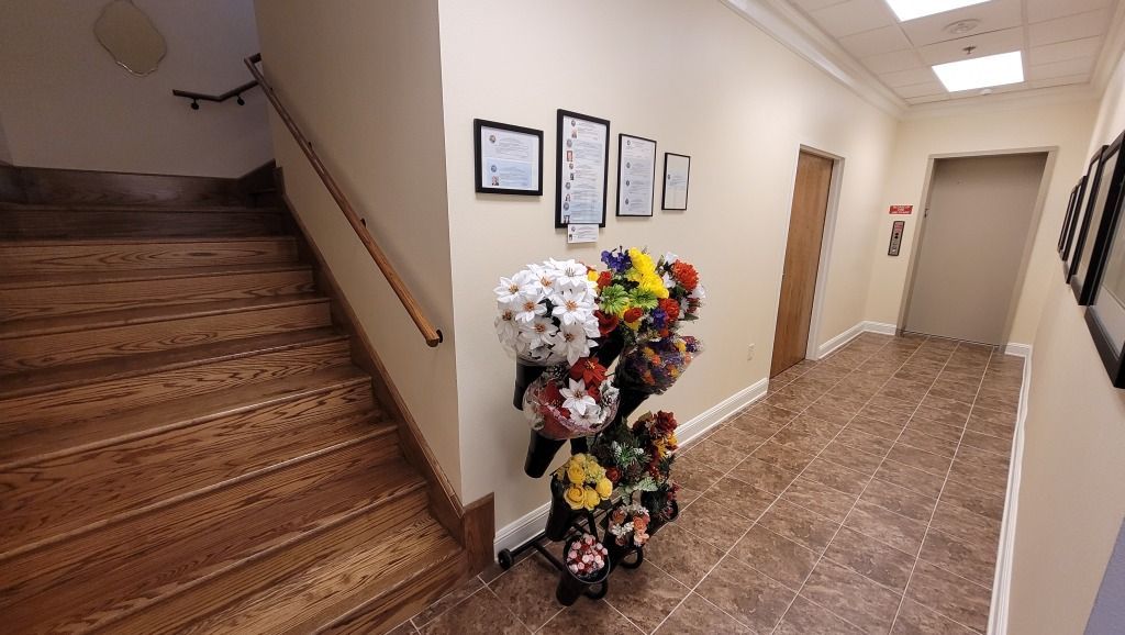 Highland Funeral Home Hallway with Stairs and Flowers