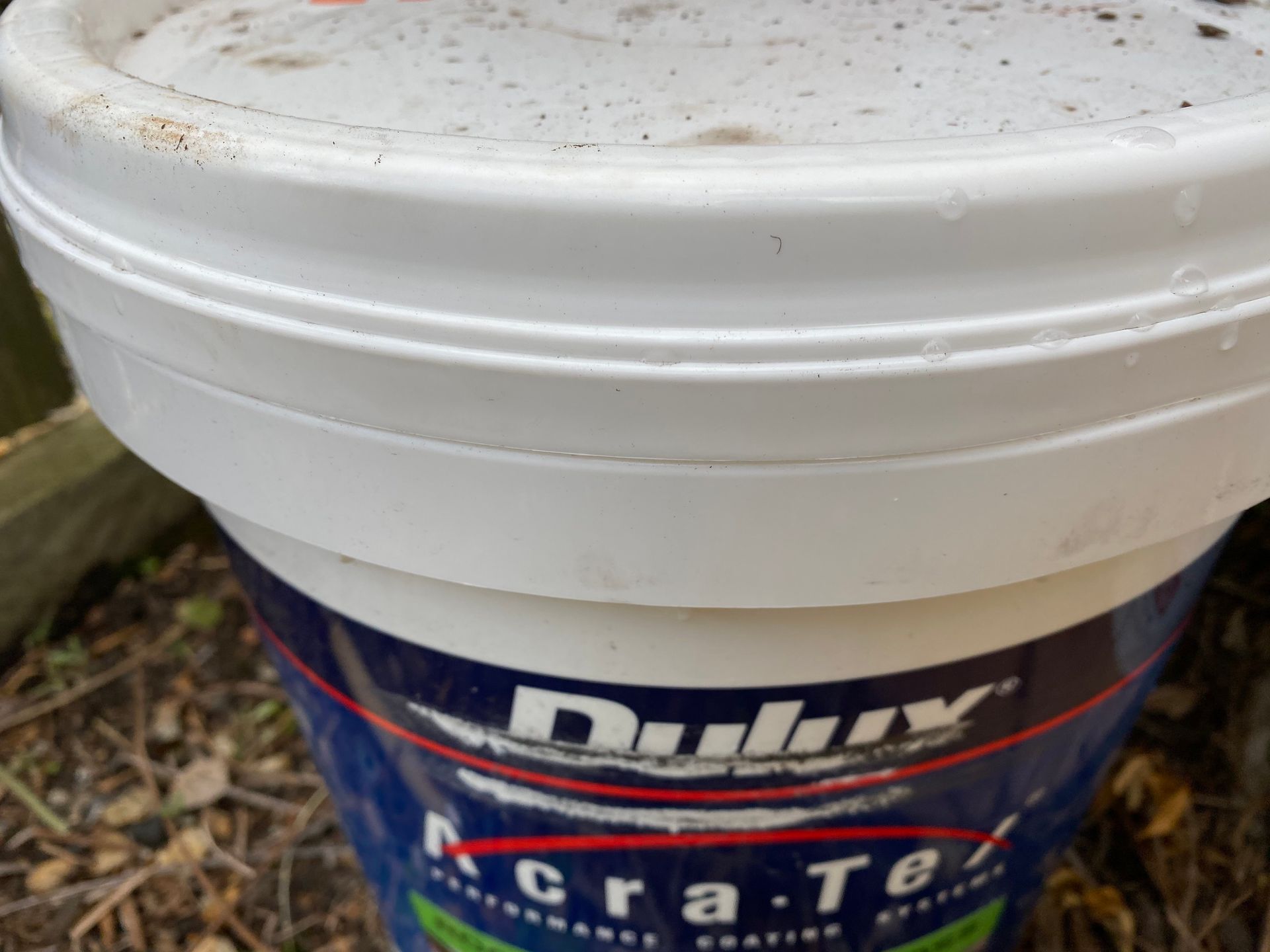 Close-up of a white paint bucket with 