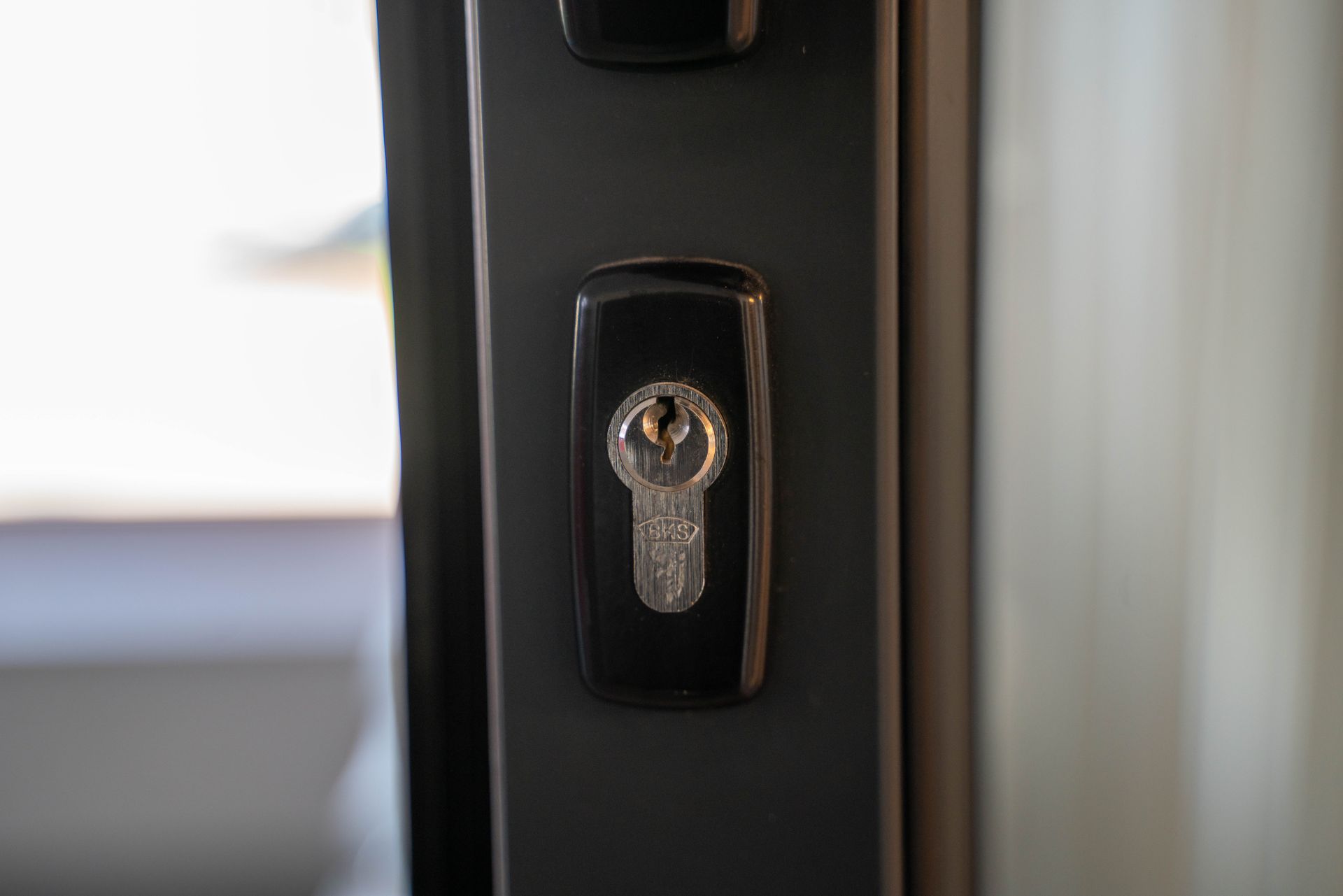 Black door lock with keyhole.