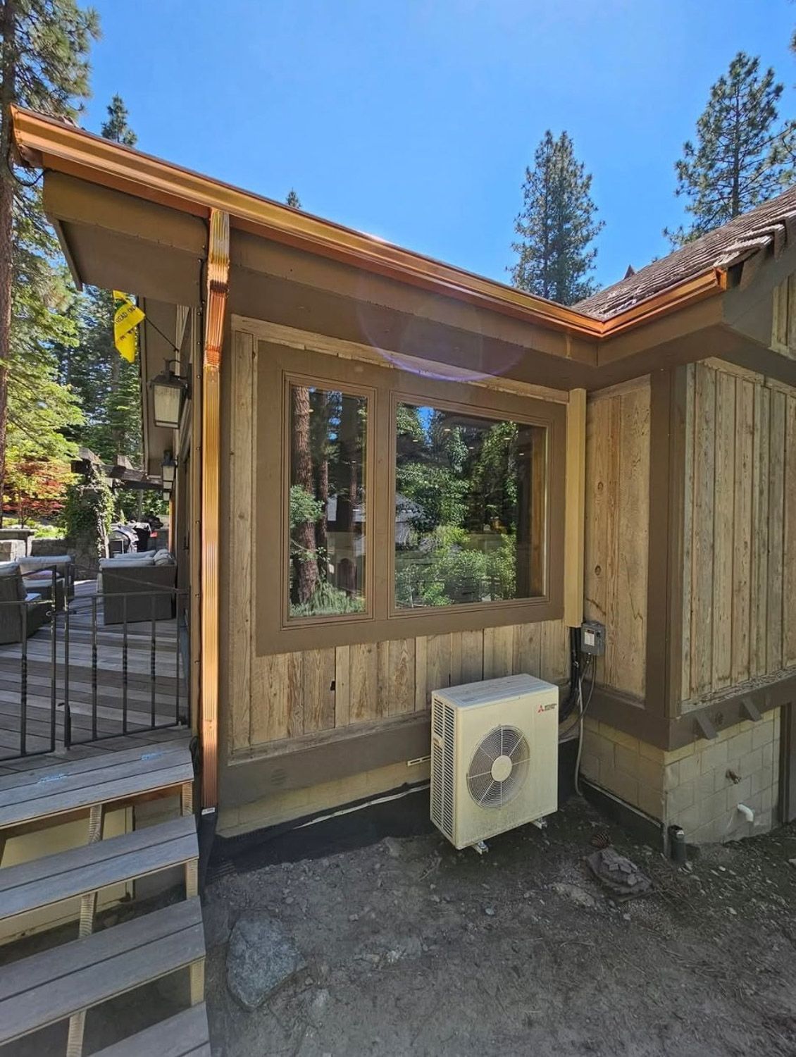 Exterior view of a Reno home with new sealmess copper guttersfrom Gutter Specialist.
