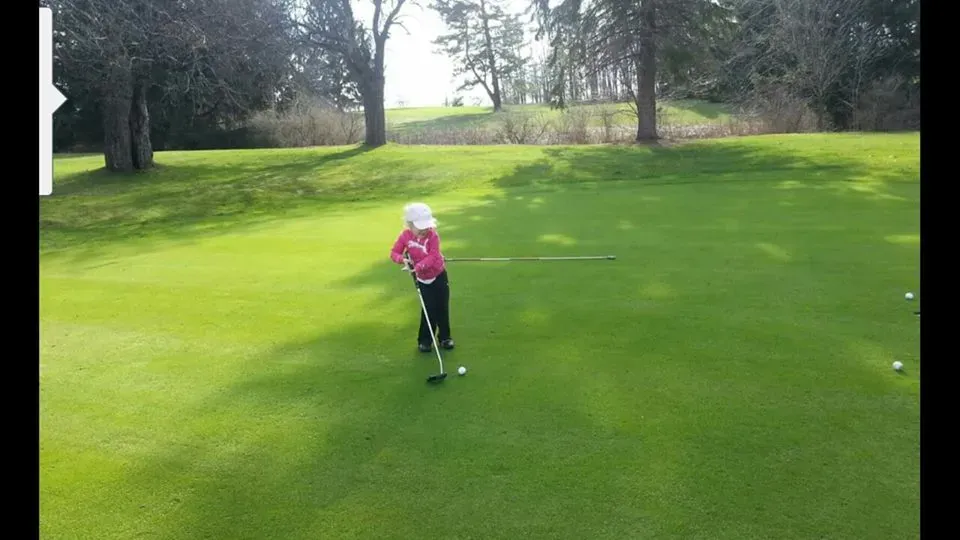 Kid Playing Golf