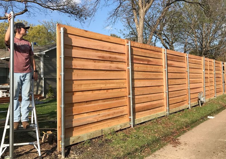 Cedar fence installation. Saginaw, MI