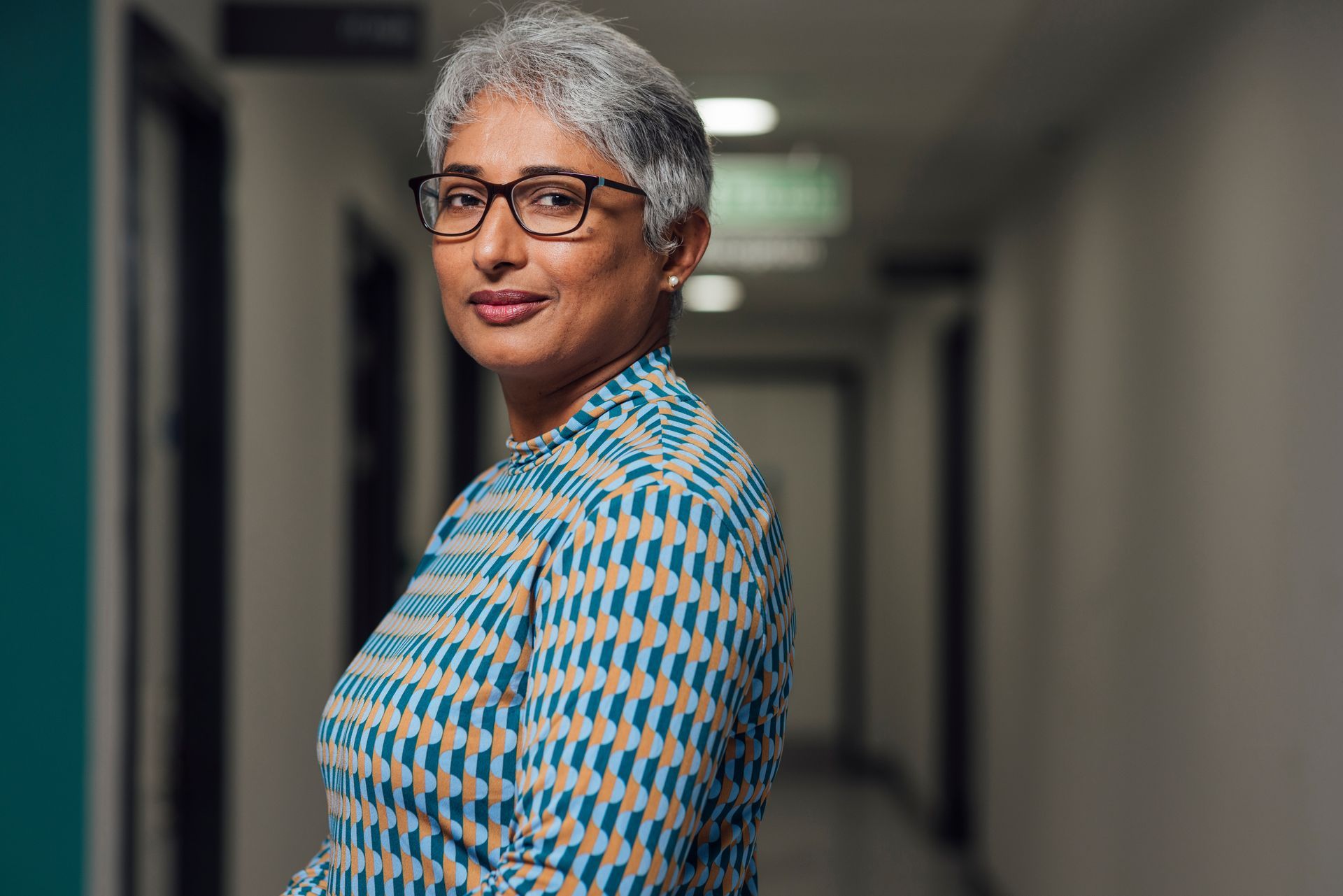 Female Medical locum doctor in hospital hallway