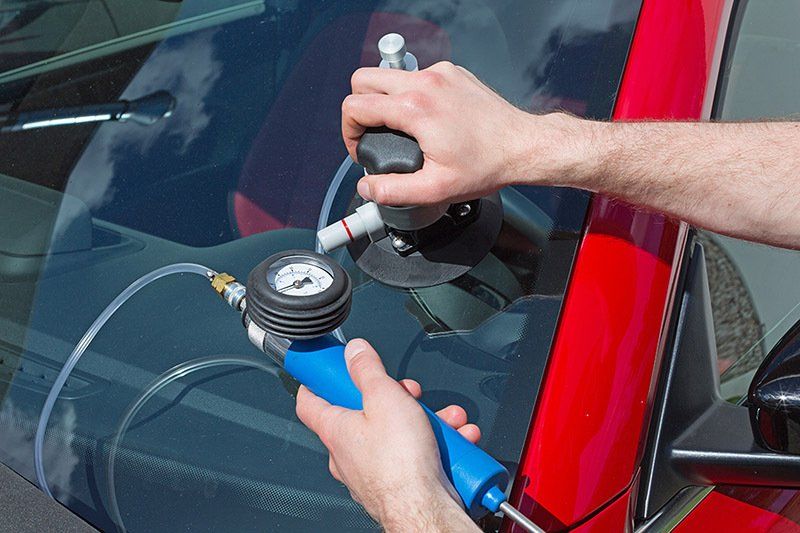 Repairing windshield at Skates Auto Glass
