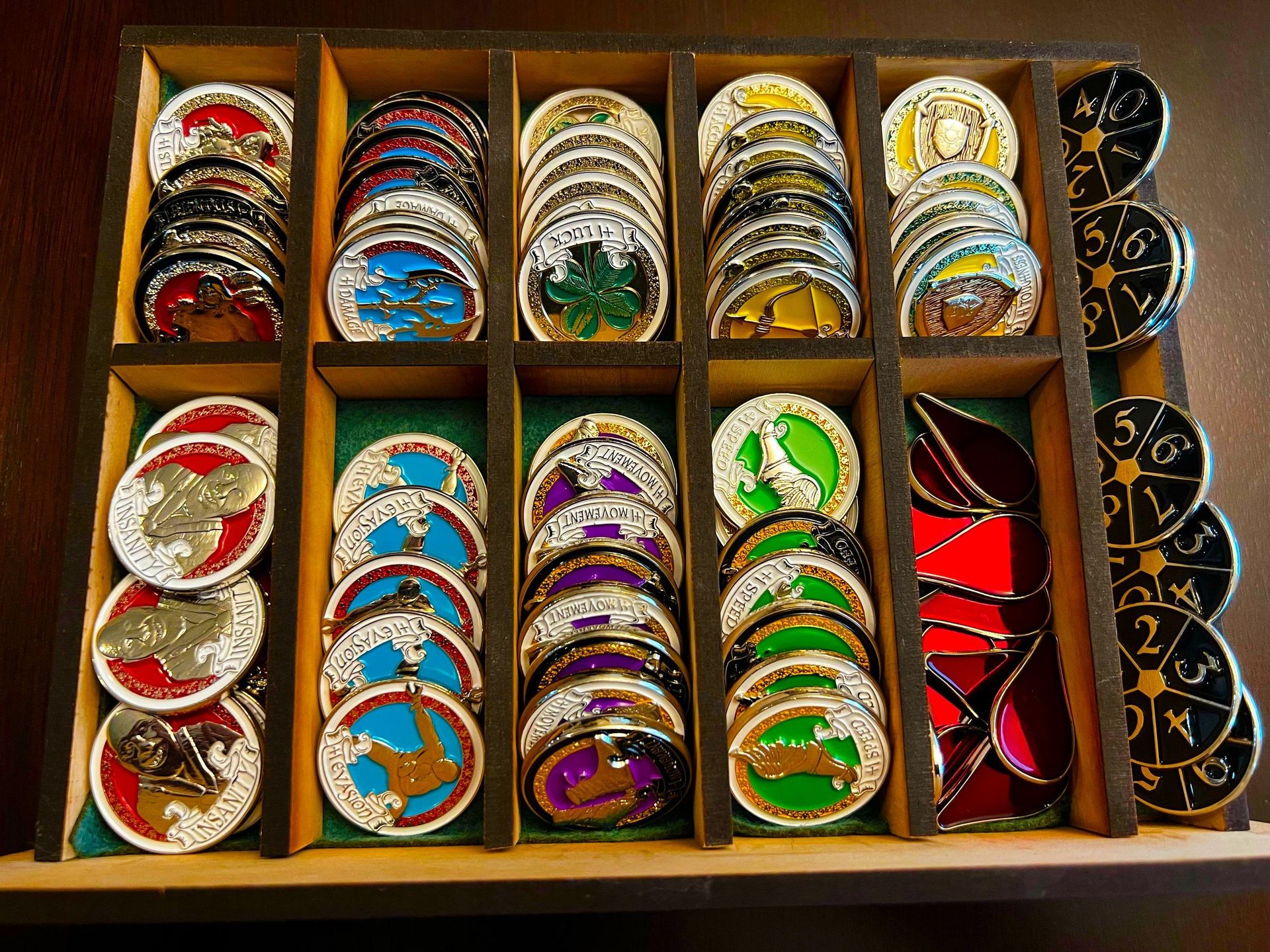 Colorful bangles and bracelets arranged in wooden compartments and stacked along the right edge
