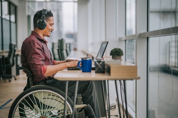 Smiling working man in wheelchair | Becker, MN | Current Accessibility Solutions