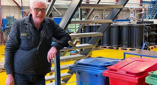Karsten Lykkegaard with some of the waste bins at the factory Karsten Lykkegaard with some of the waste bins at the factory