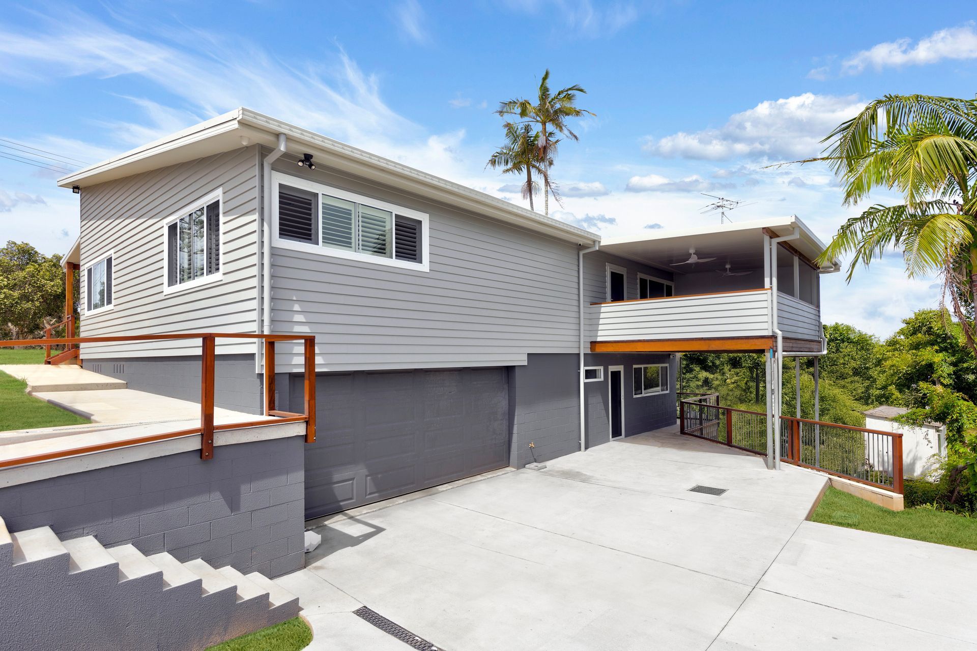 A Wooden Deck With Stairs Leading Up To It — Nambucca Construction In Macksville, NSW
