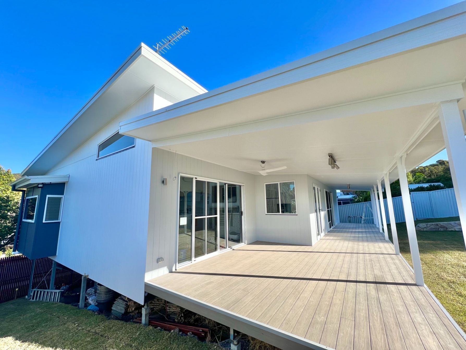 A House With Stairs And A Satellite Dish On Top Of It — Nambucca Construction In Nambucca Heads, NSW