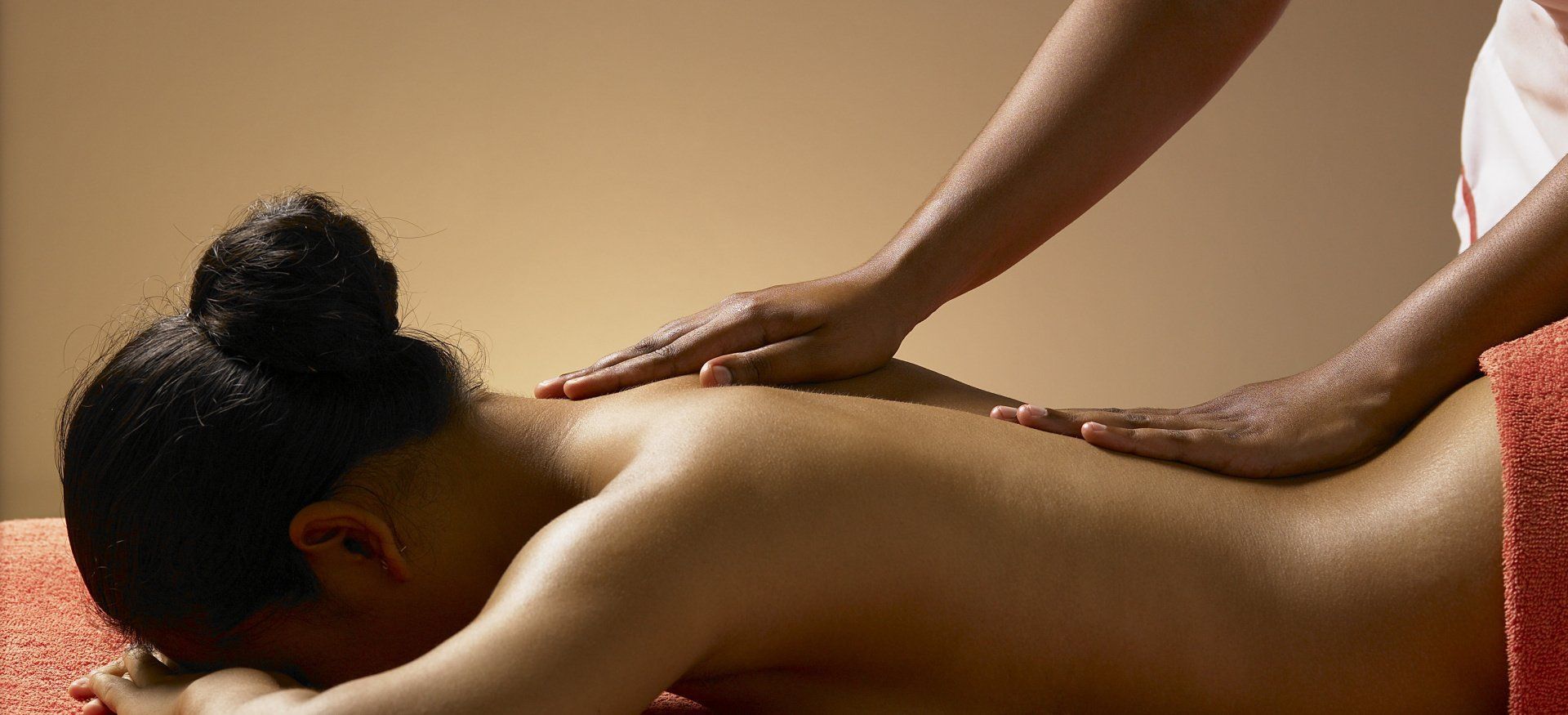 therapist giving a back massage