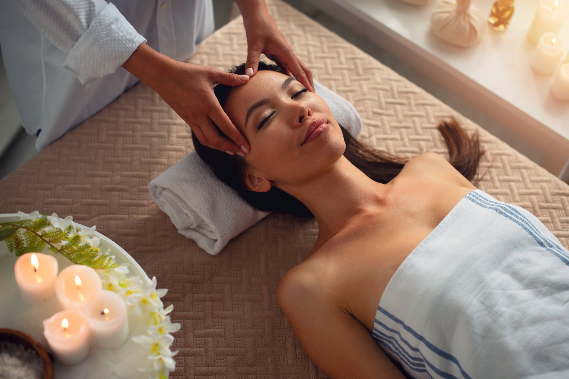 a woman getting a facial treatment