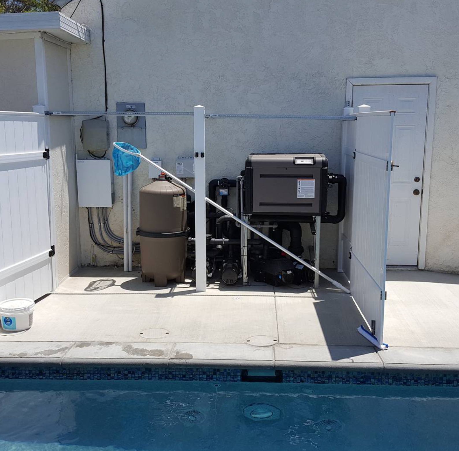 Pool automation equipment and valves at a Bakersfield CA pool equipment pad