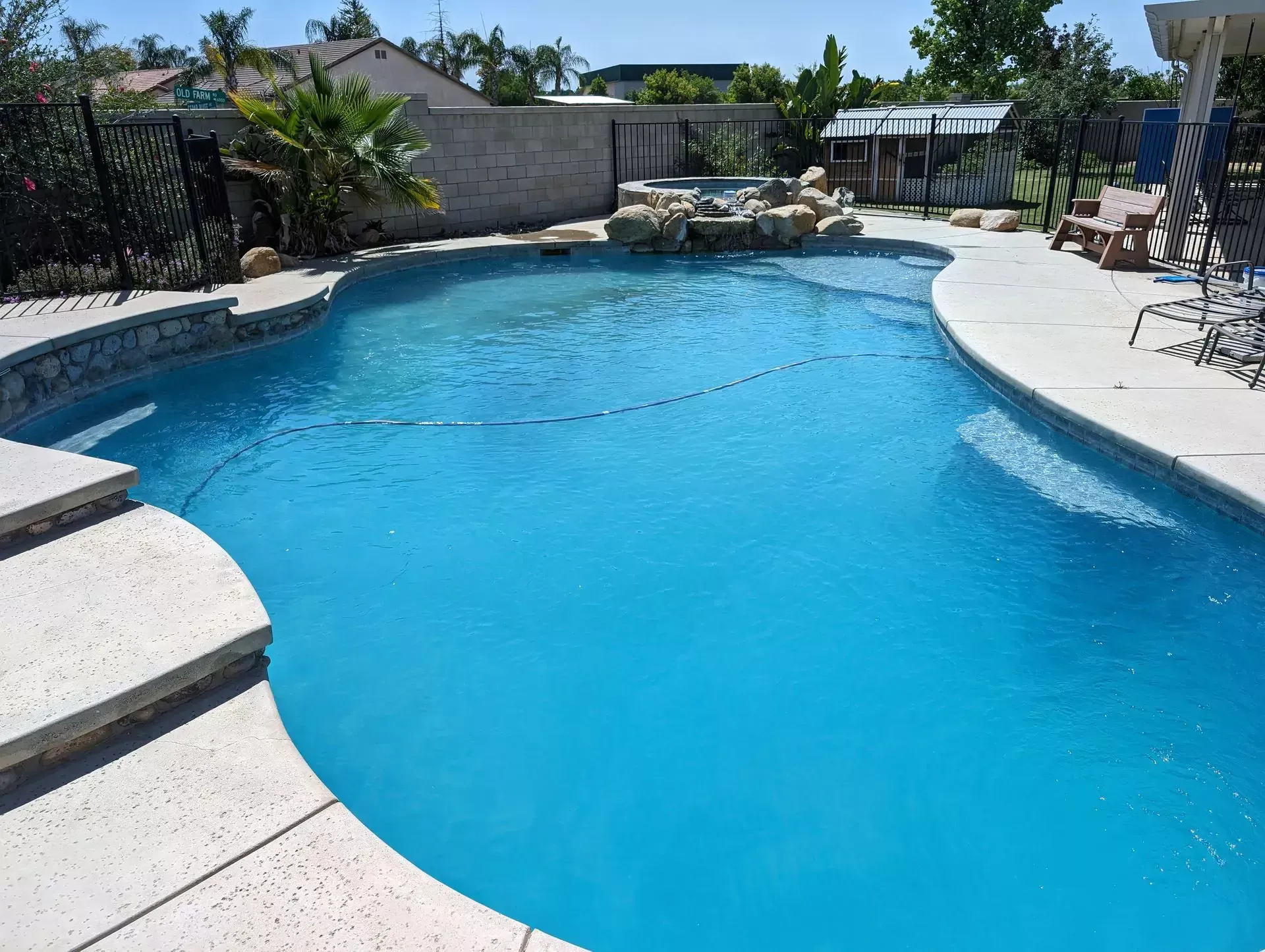 Crystal clear Bakersfield pool after professional cleaning service by Hurst Pool Service