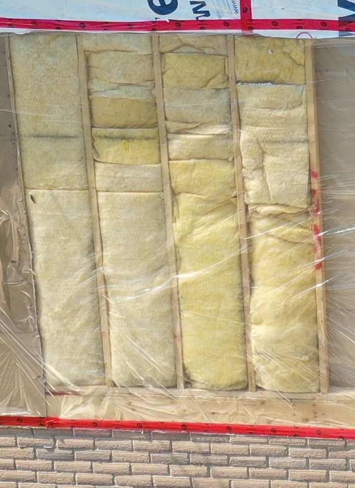 A brick wall with a lot of insulation on it.