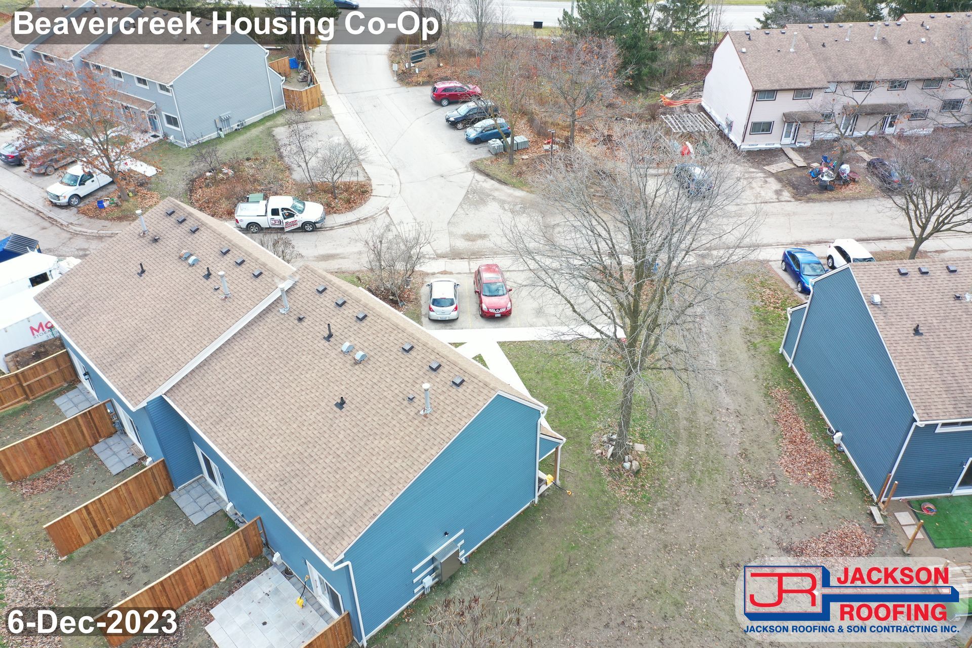An aerial view of a row of houses in a residential area.