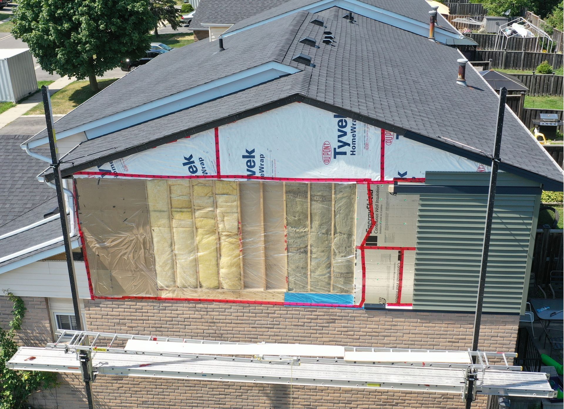 An aerial view of a house that is being remodeled.