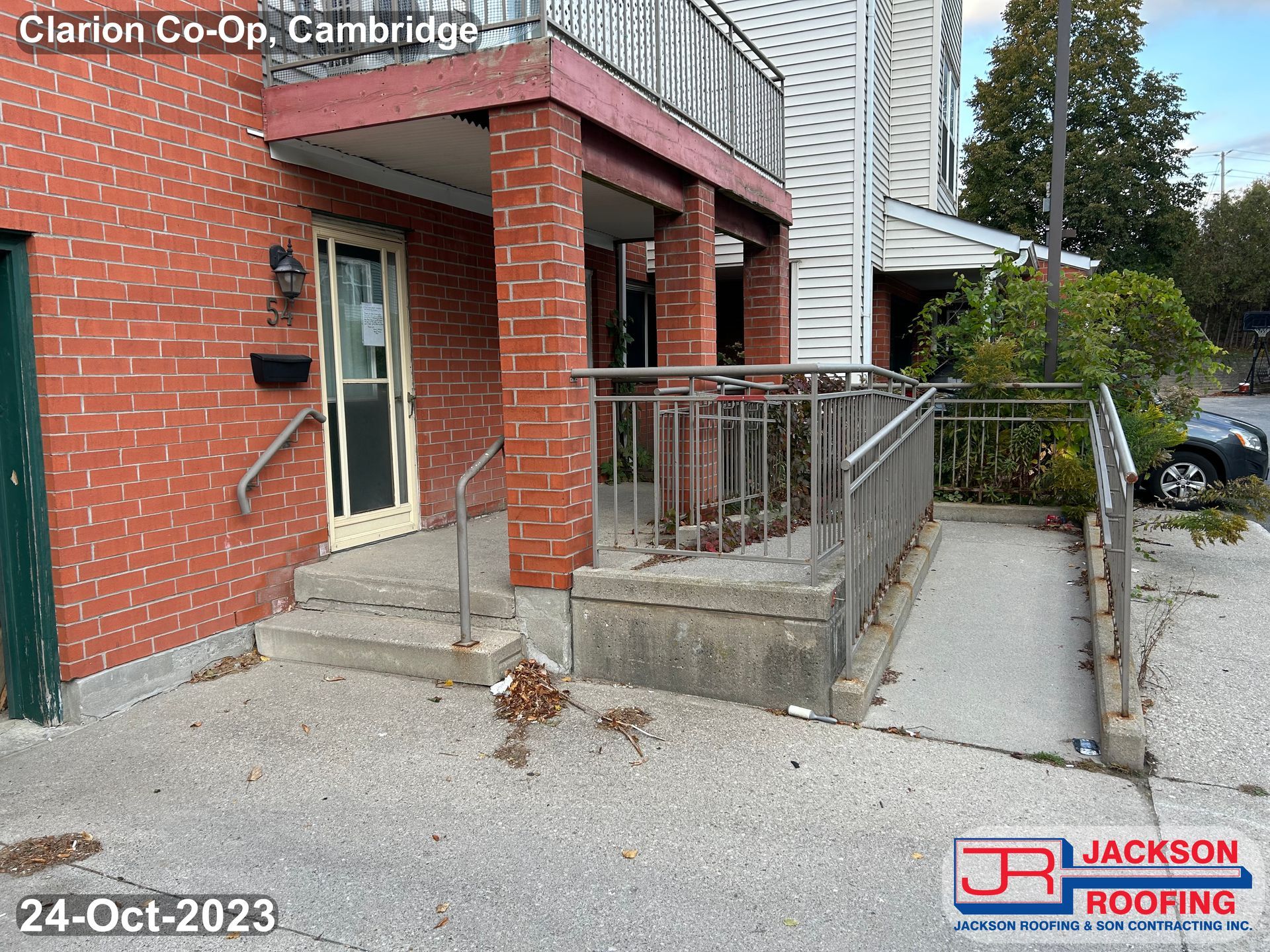 A brick building with a ramp leading up to it