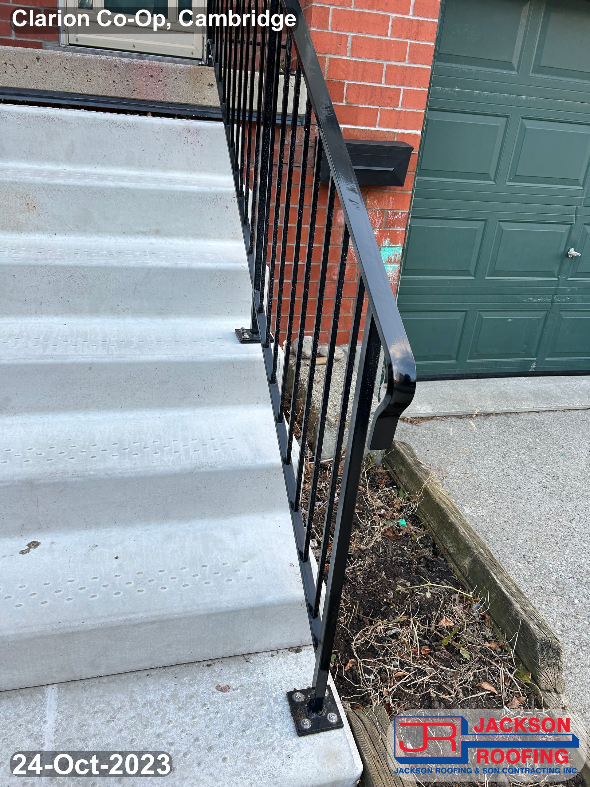 A picture of a wrought iron railing on a set of stairs.