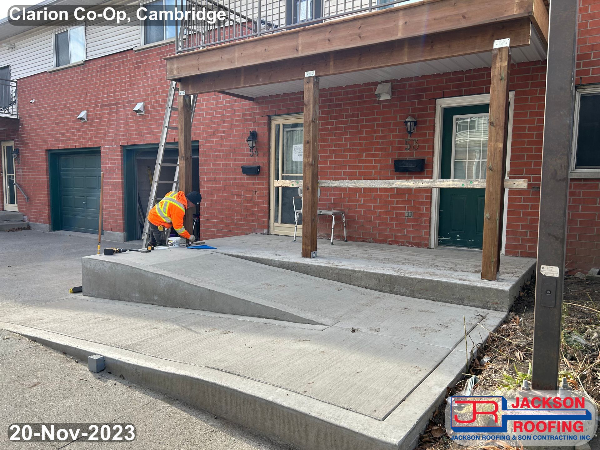 A brick house with a ramp leading up to it