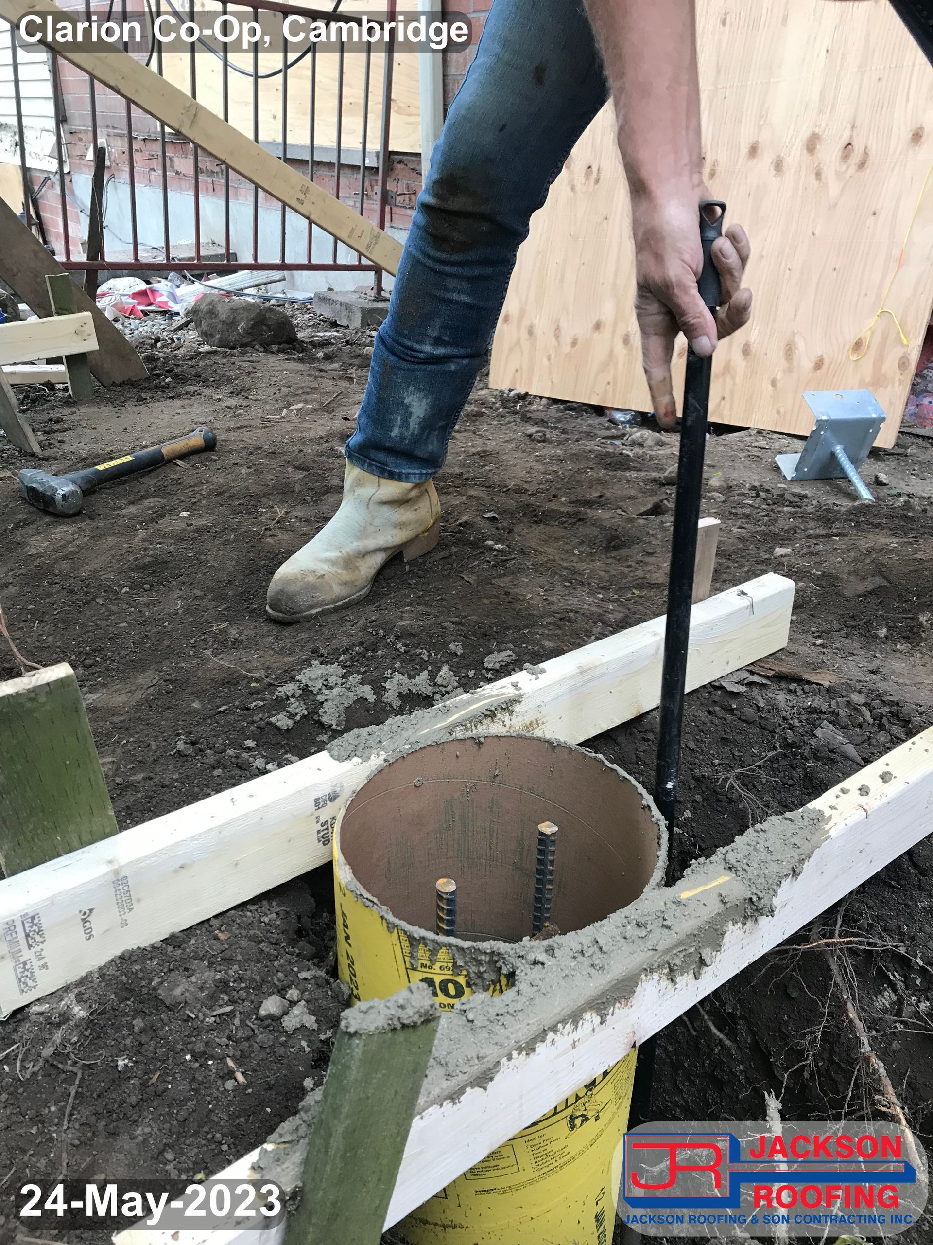 A person is digging a hole in the ground with a shovel.