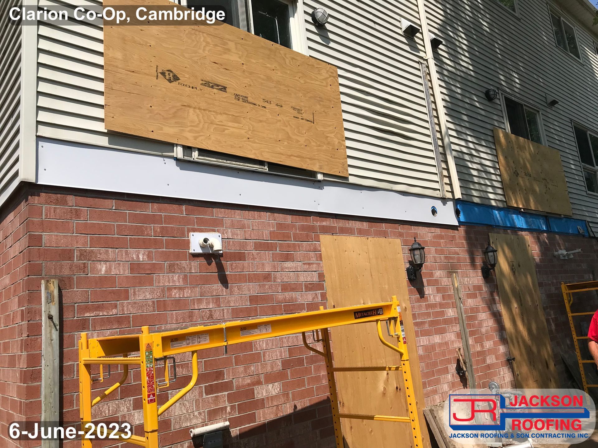 A brick building with a sign that says clarion co-op cambridge