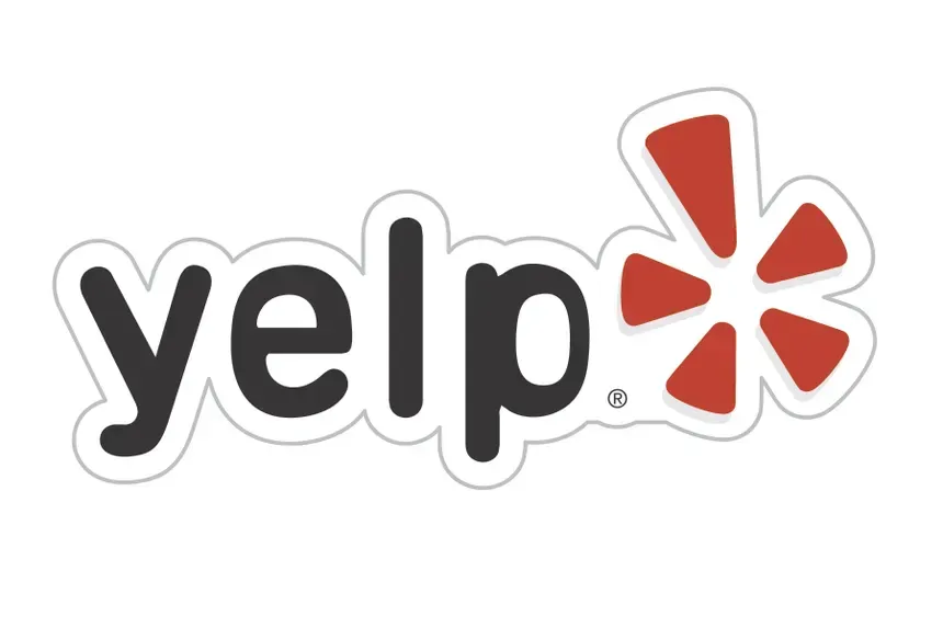 Yelp logo in black text with a red burst icon on a white background