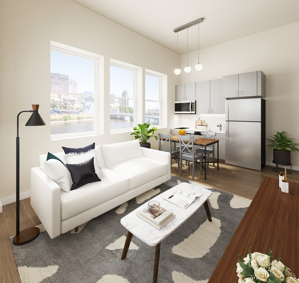 A living room with a white couch and a coffee table
