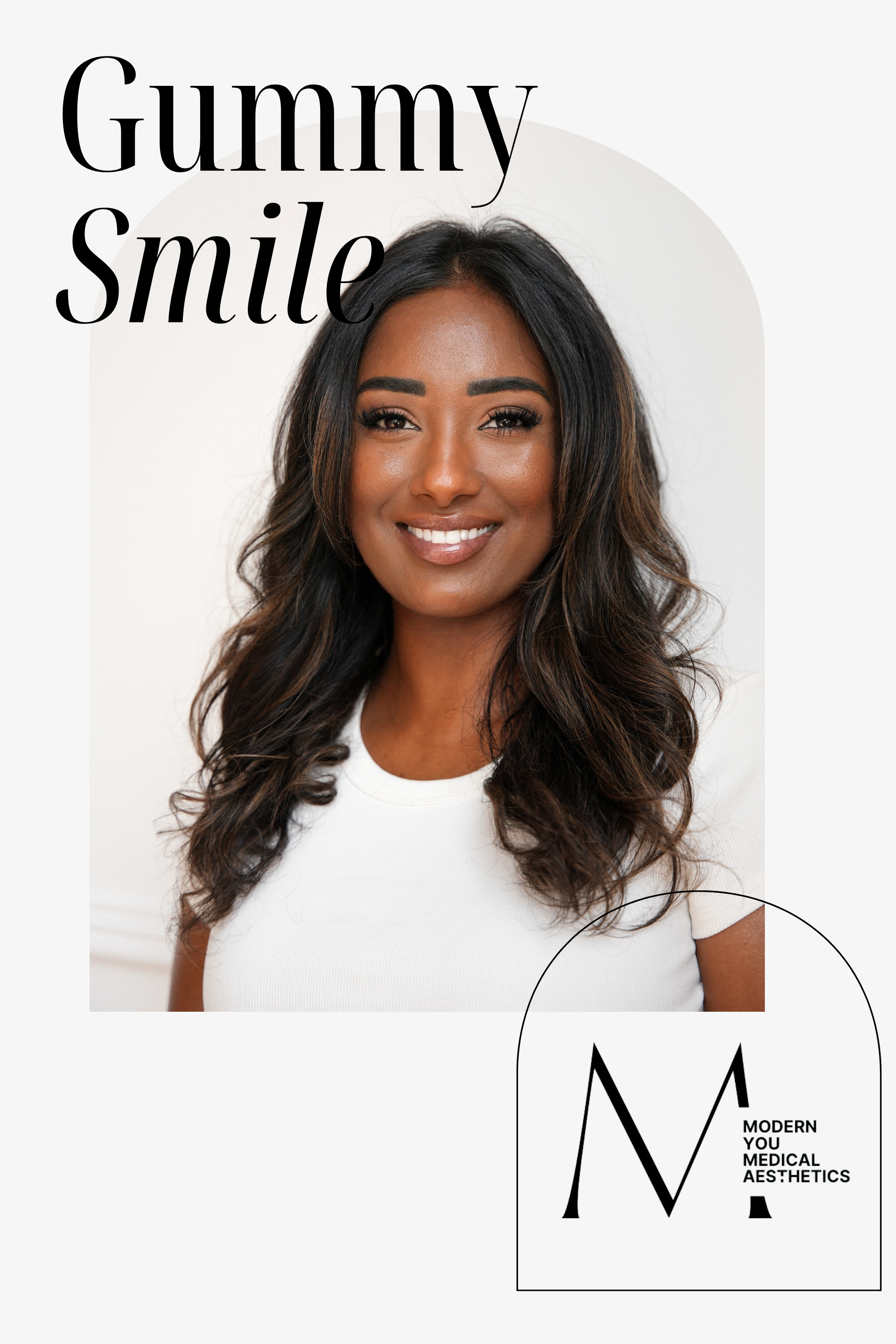 Smiling woman with long dark hair, white top, and 