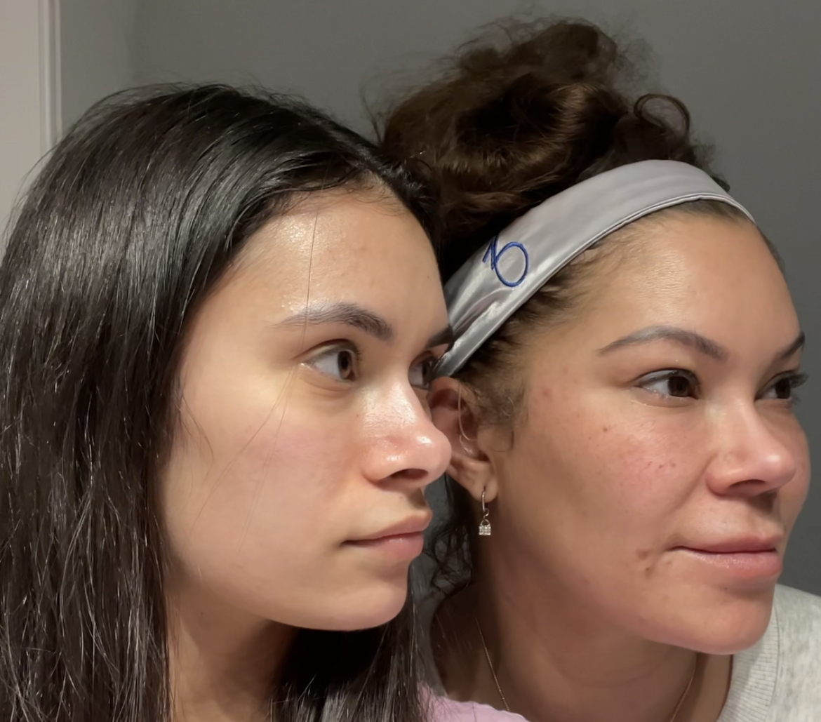 Two women looking to the side, one younger with dark hair, the other older with a headband, side-by-side.