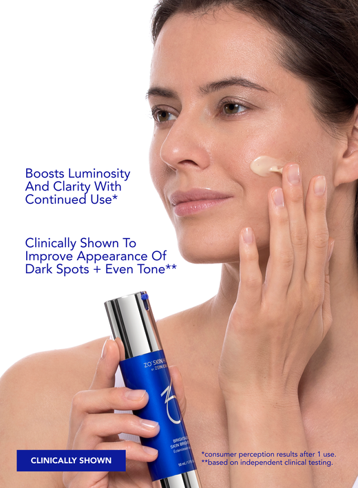 Woman applying cream to cheek beside text promoting brighter skin and reduction of dark spots