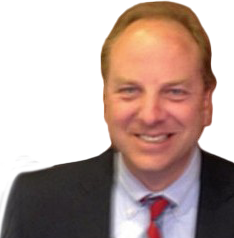 A man in a suit and tie smiles for the camera