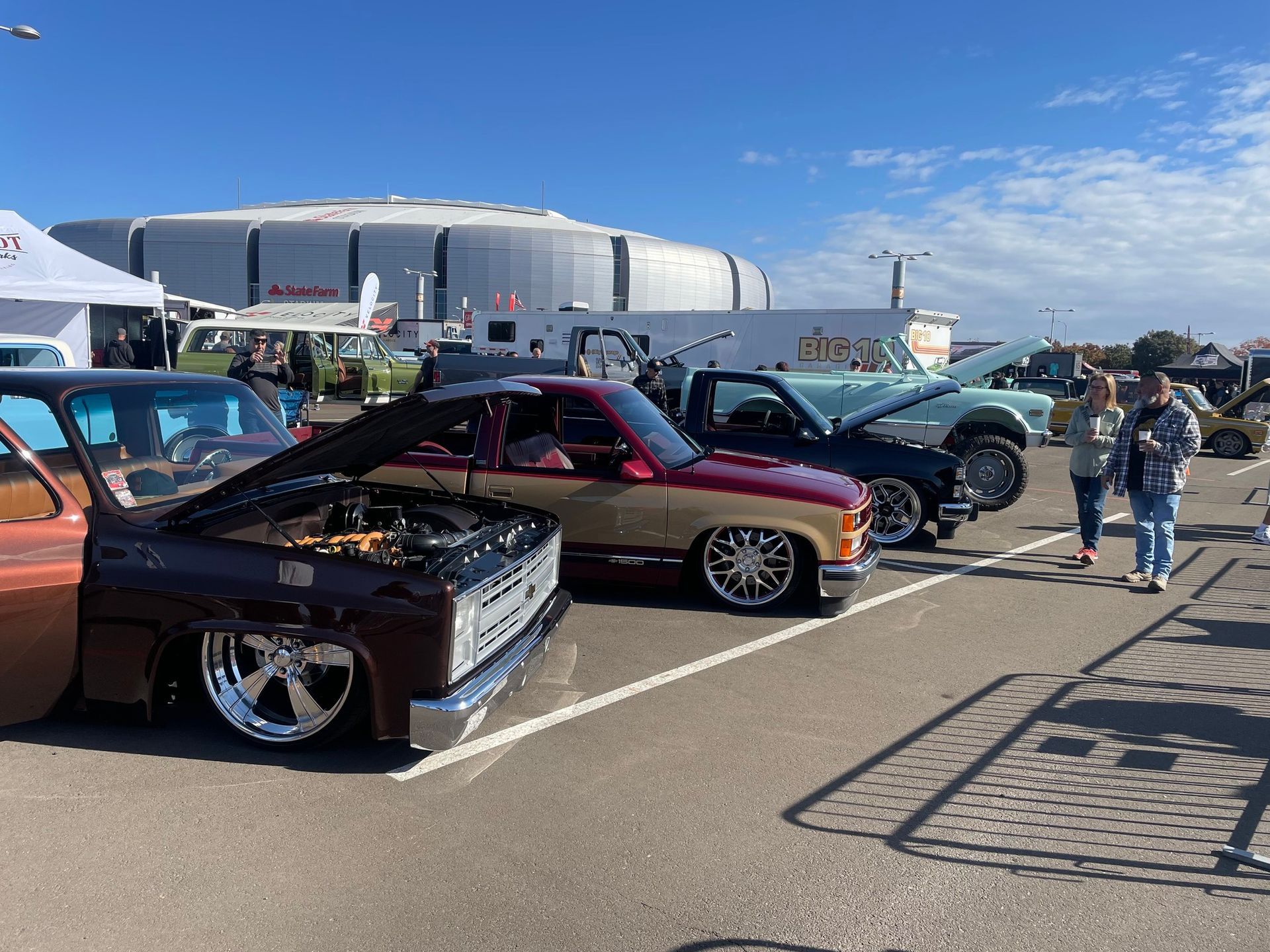 an auto show with several classic cars displayed