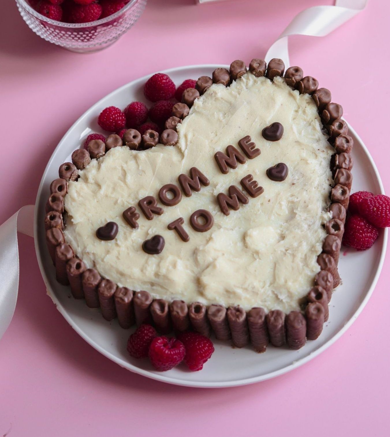 A heart shaped cake that says from me to me