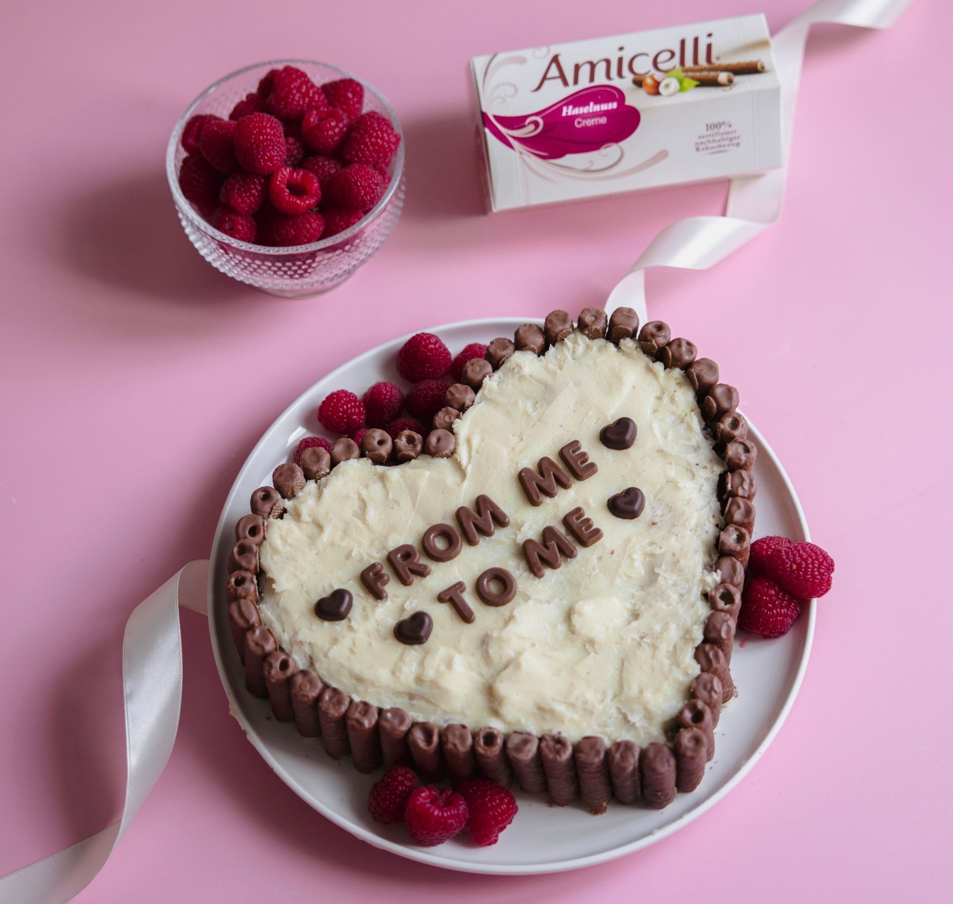 A heart shaped cake that says from me to me