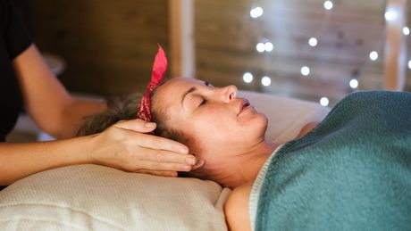 Reiki being performed on a woman