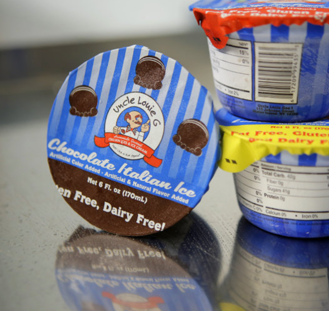 Chocolate Italian ice cups stacked; blue and yellow lids, product label reads “Chocolate Italian Ice, Gluten Free, Dairy Free!”