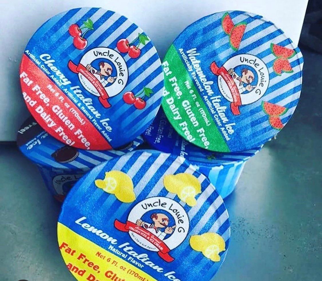 Three Uncle Louie G's Italian ice containers: cherry, watermelon, and lemon flavors.