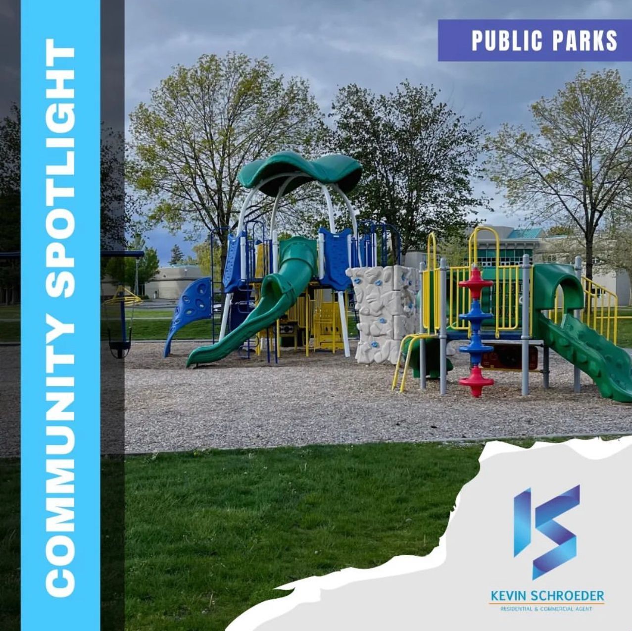 Playground with slides, climbing wall, and structures on gravel, green grass. 
