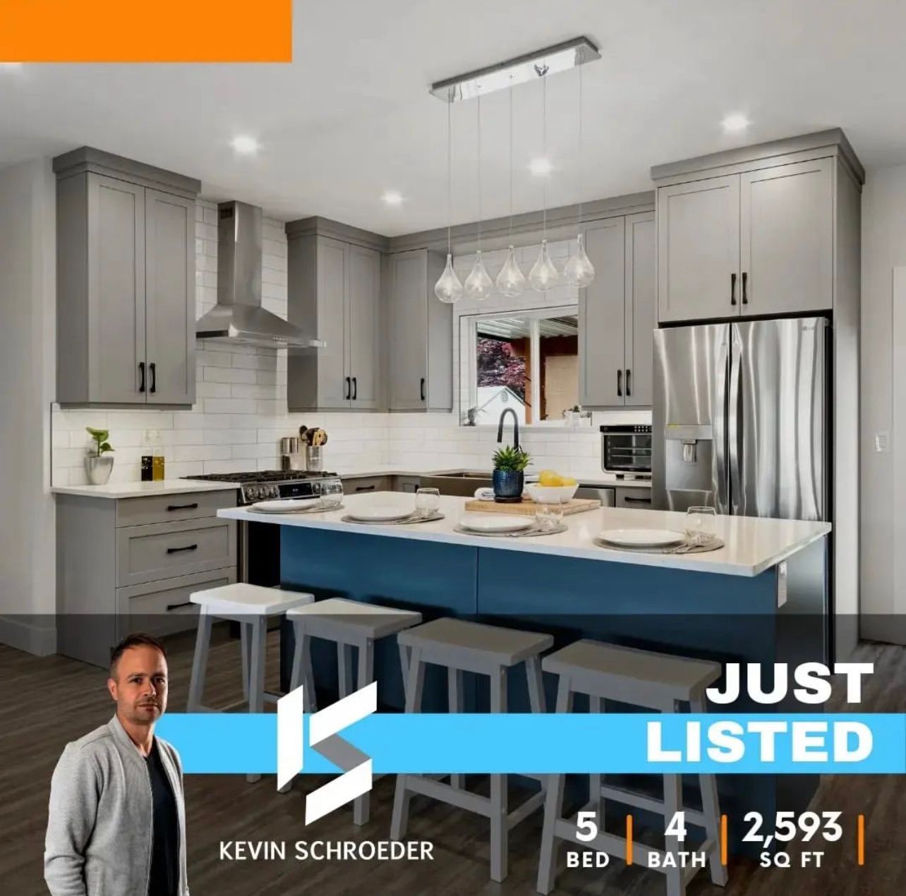 Modern kitchen with grey cabinets, blue island, stainless steel appliances; 