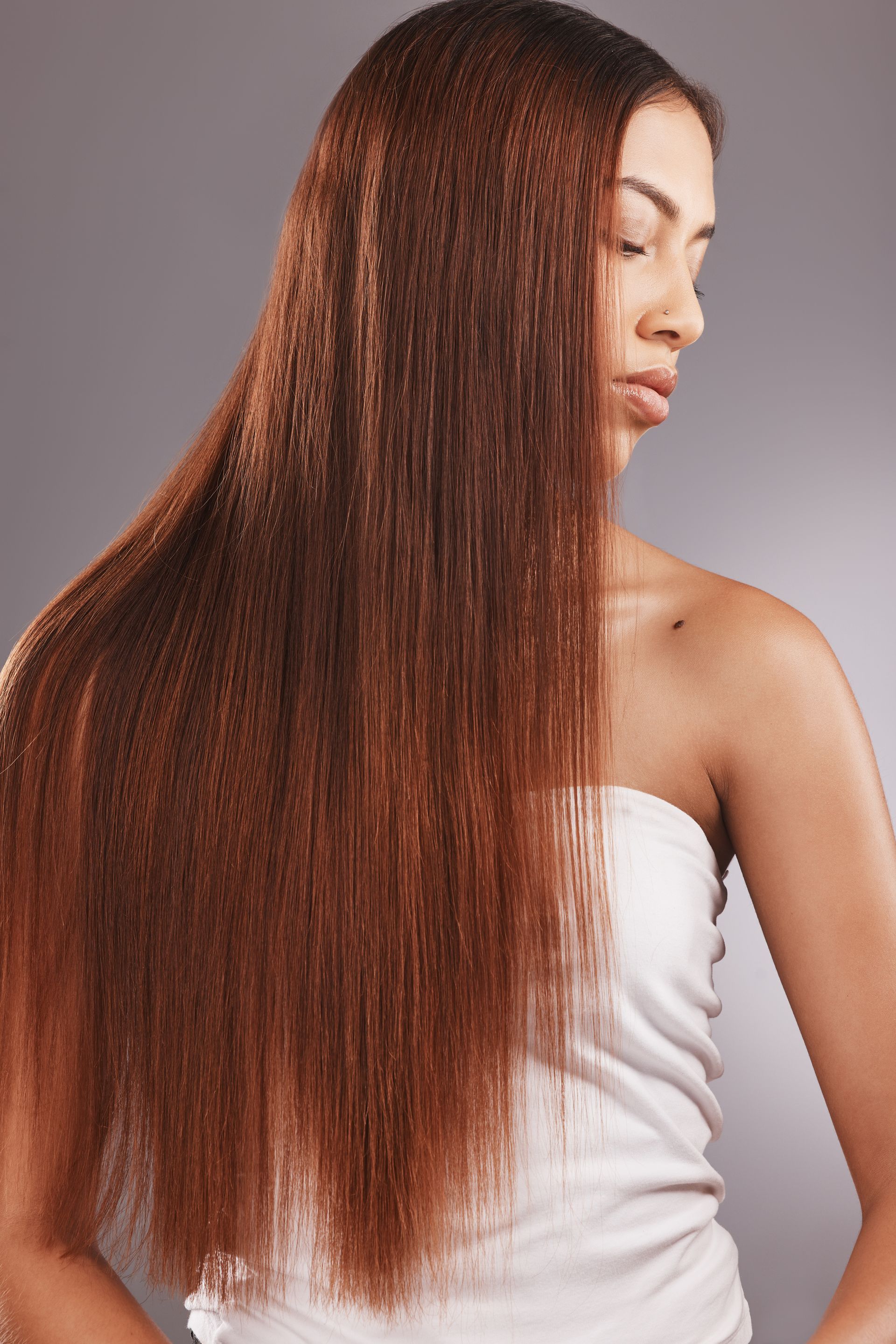 African American woman who has long smooth hair.